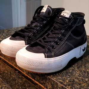 Adidas Nizza Trek platform sneaker.  Black with white stitching. 8M